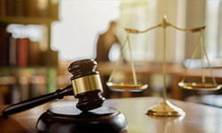 A gavel and a justice balance symbolizing law